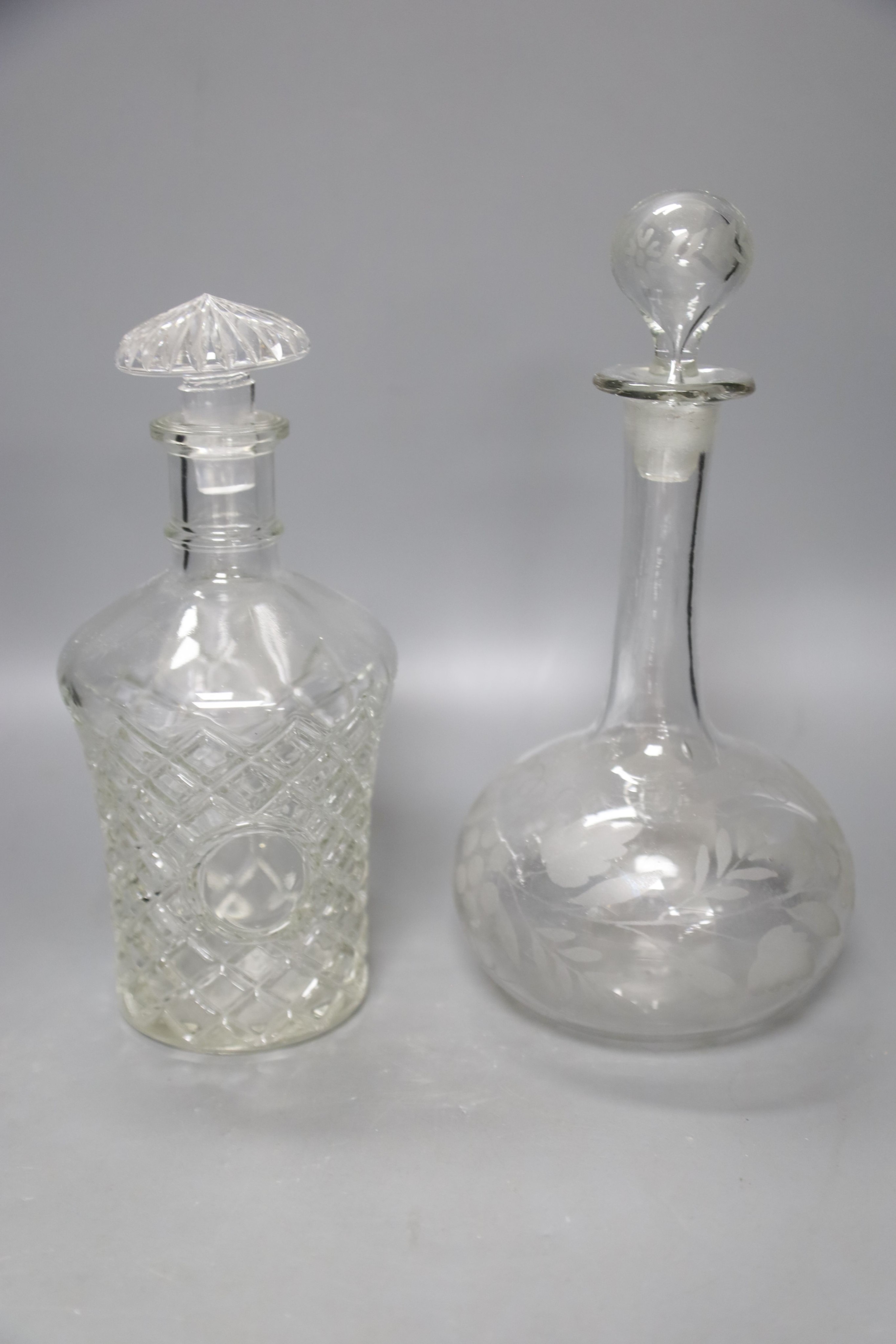 A pair of Regency small cut glass decanters, a pair of silver-mounted 'dimple' decanters, another pair of decanters and two other decanters.